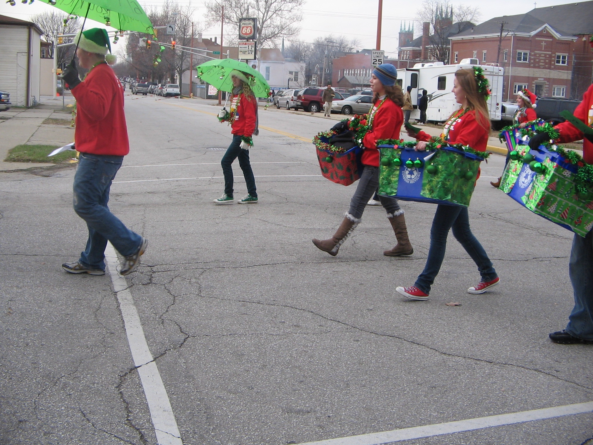 Teens in red shirts walking in a parade